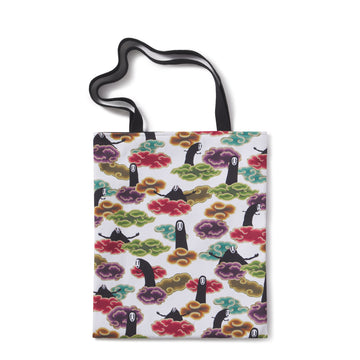 Tote bag with colorful tree and character design on a white background
